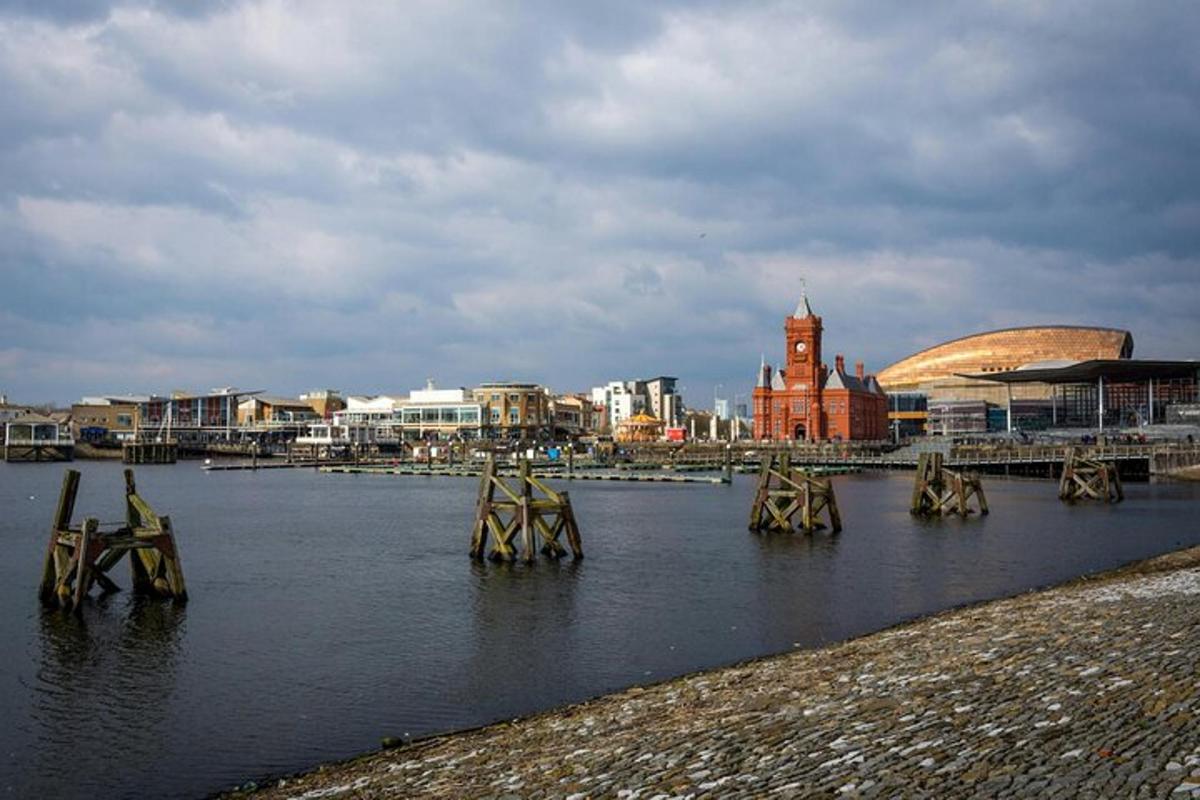 a body of water with a city in the background
