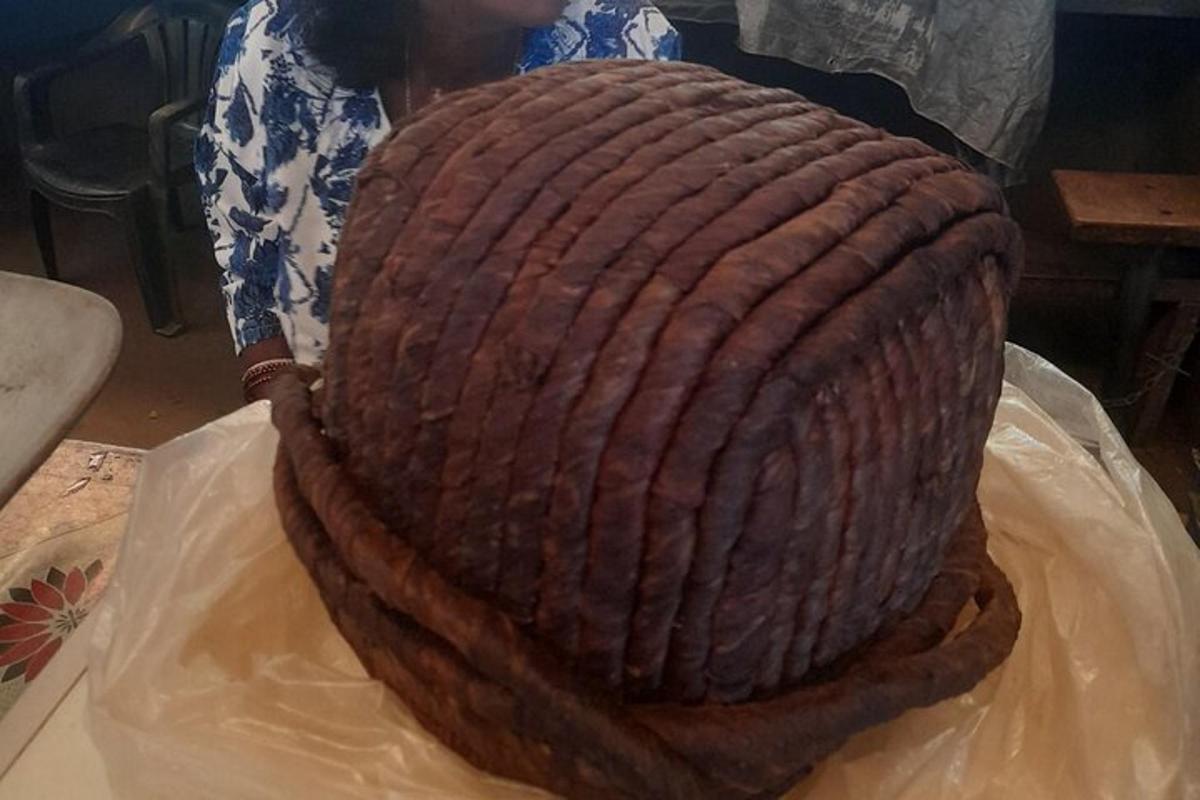 a large brown cake sitting on top of a table