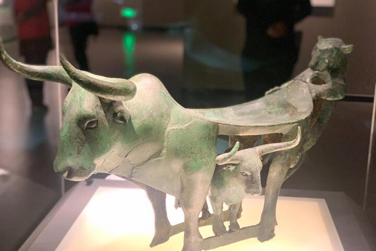 a statue of a cow and a baby bull