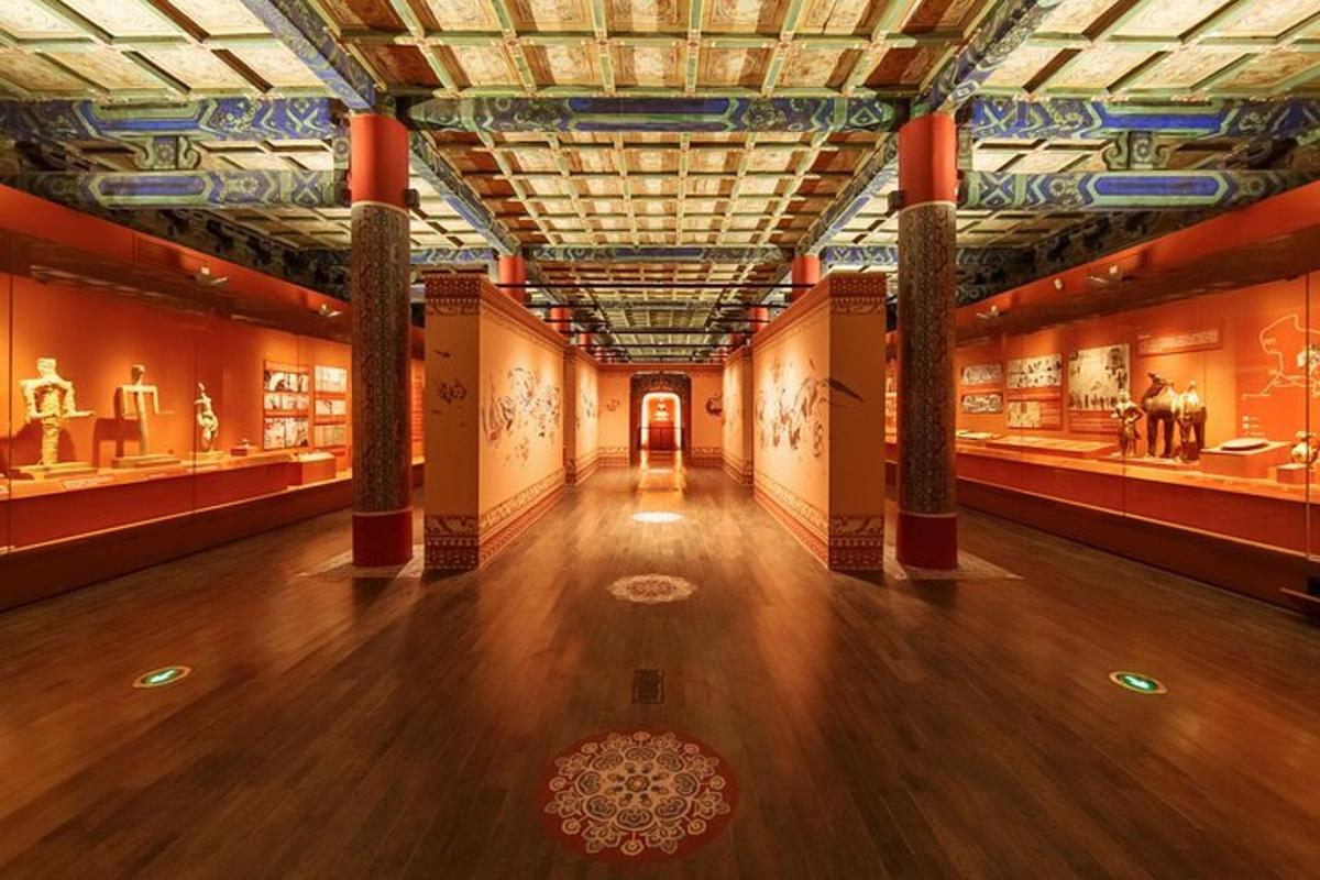 a hall in a museum with artifacts on display