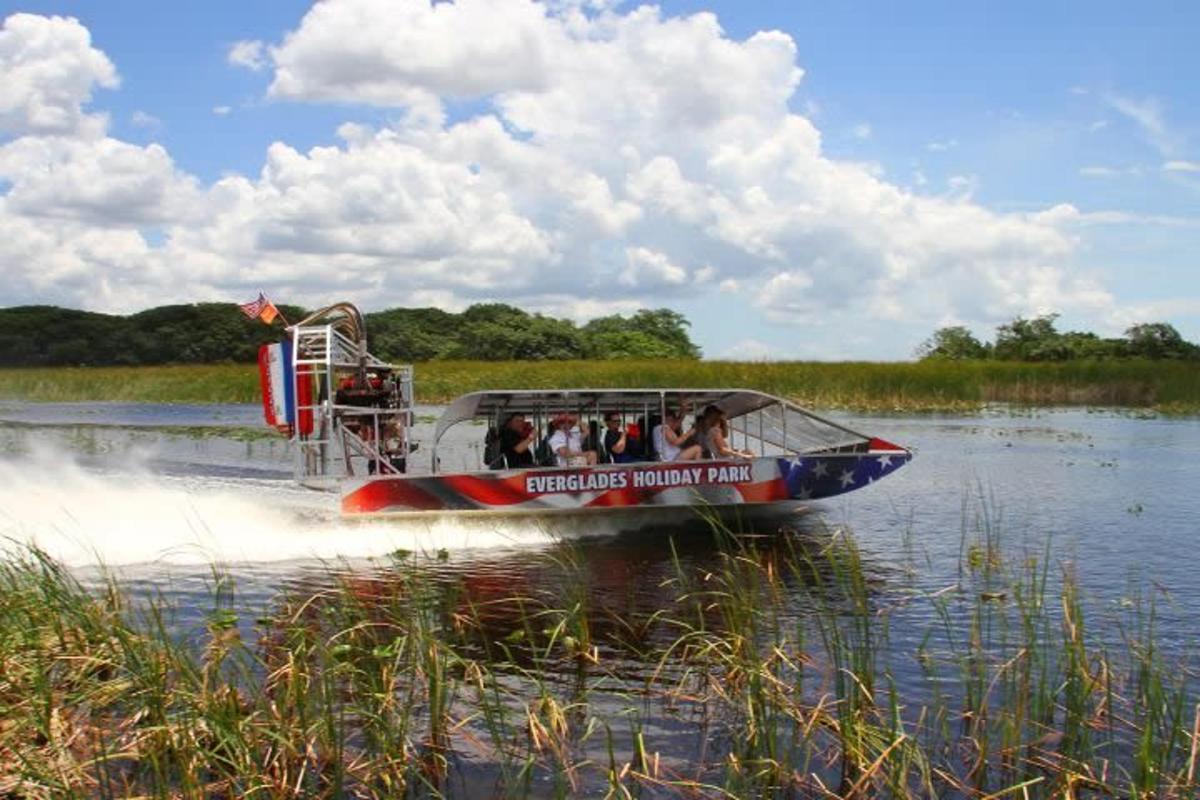 a group of people riding a boat on the water