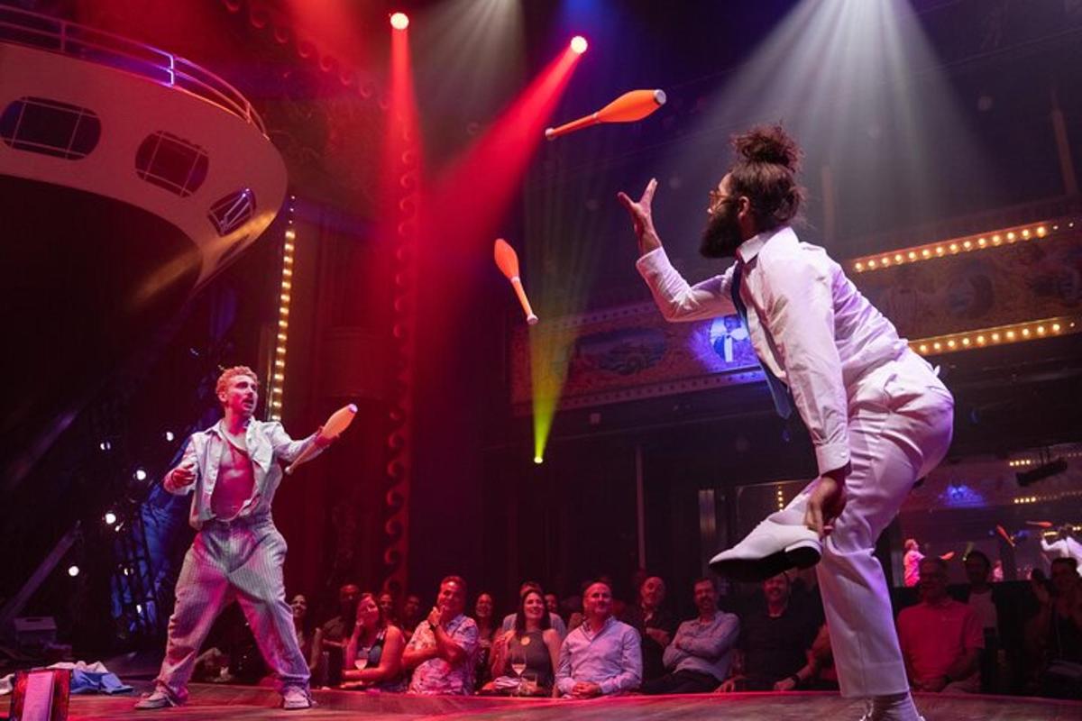 two men on the stage in front of a crowd