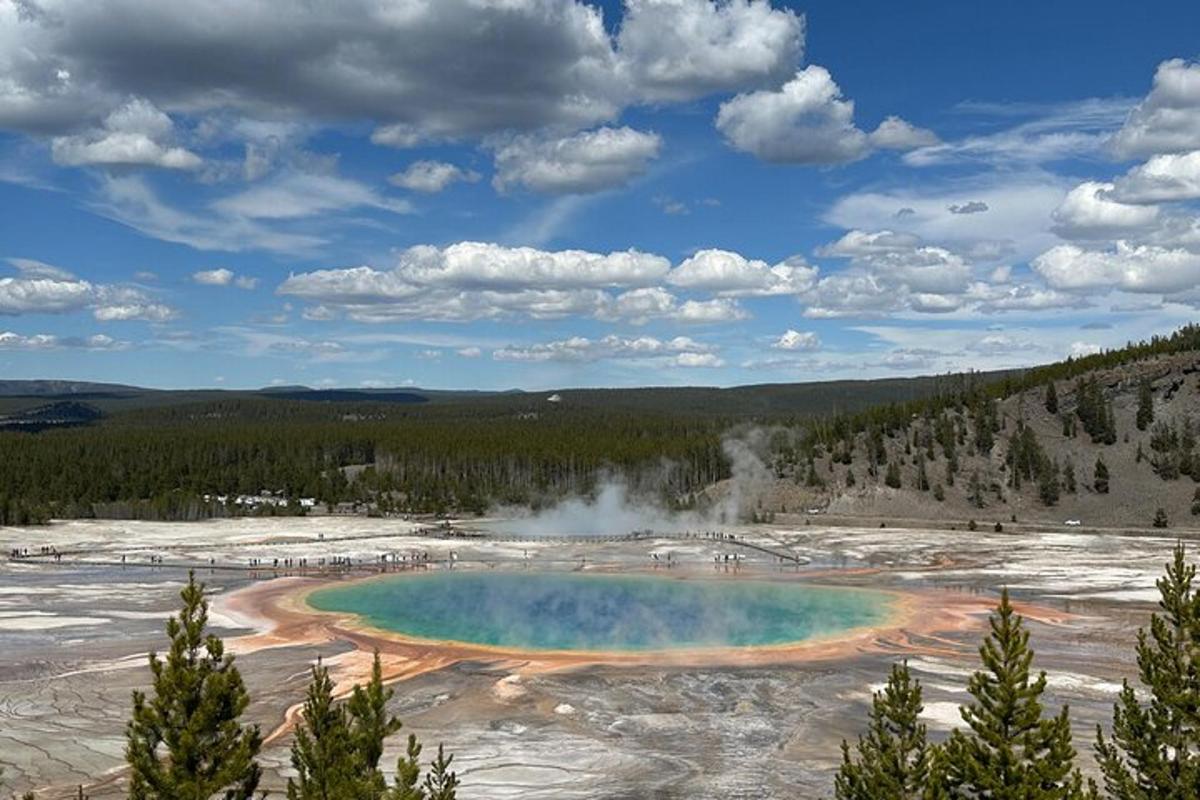 an elevated view of a geyser in a field