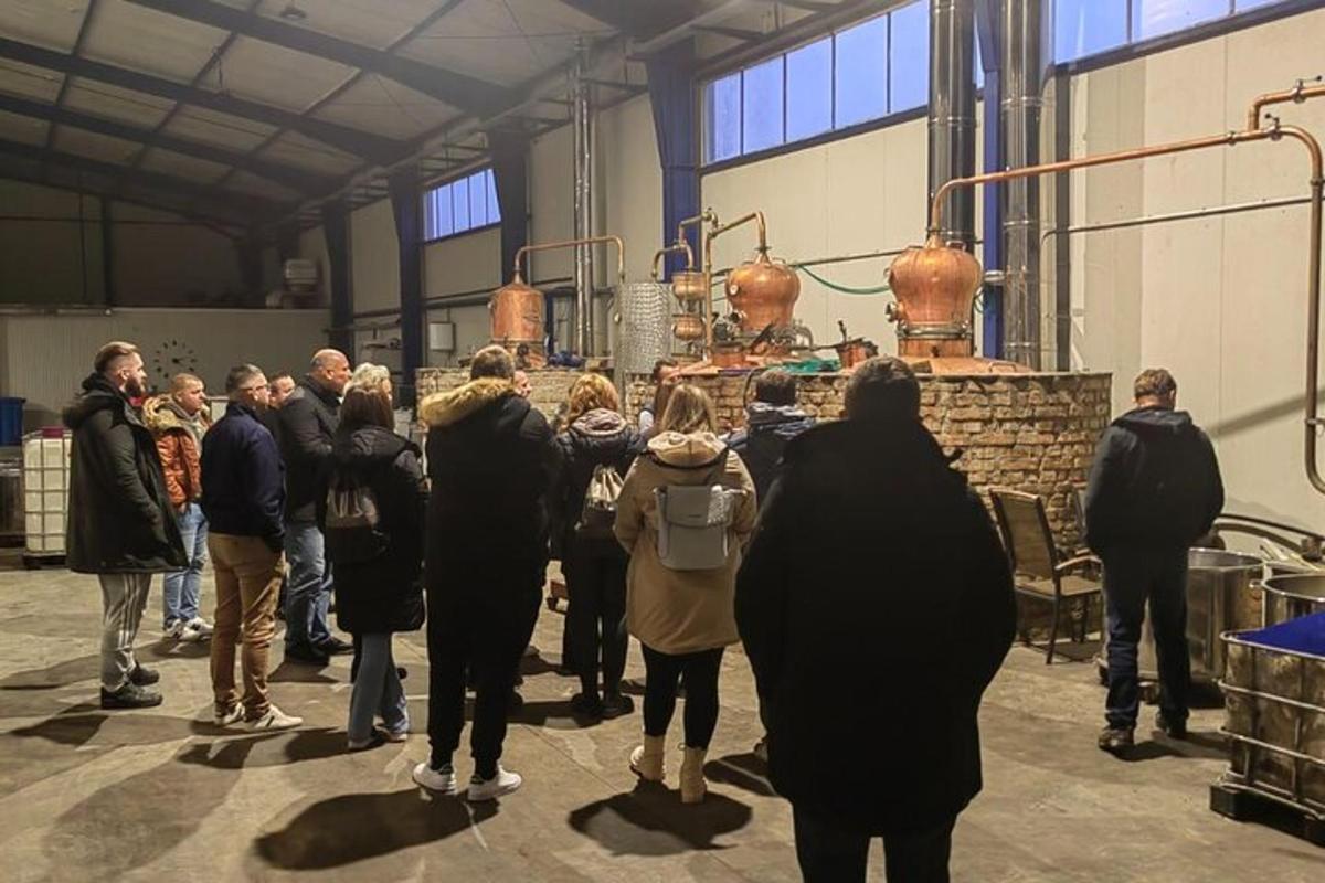 a group of people standing in a room with a machine