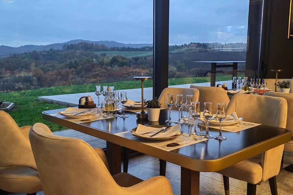 a table with chairs and wine glasses on it