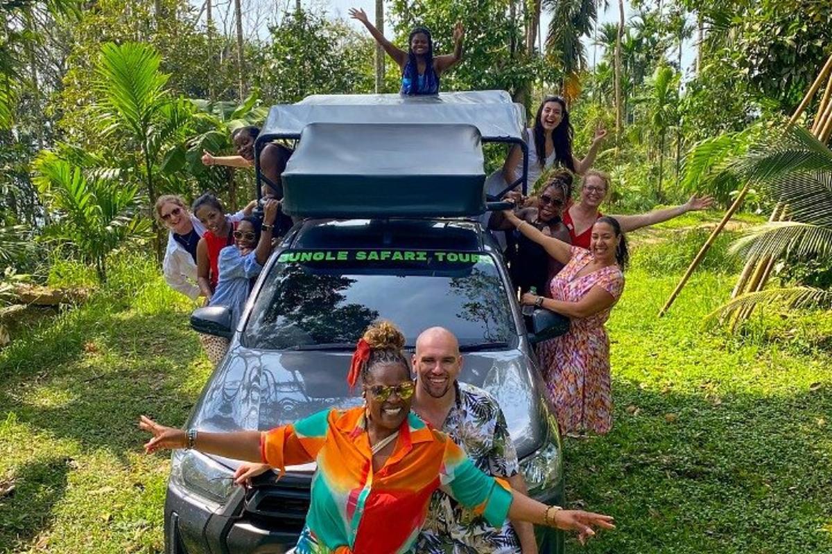 a group of people standing on the back of a car