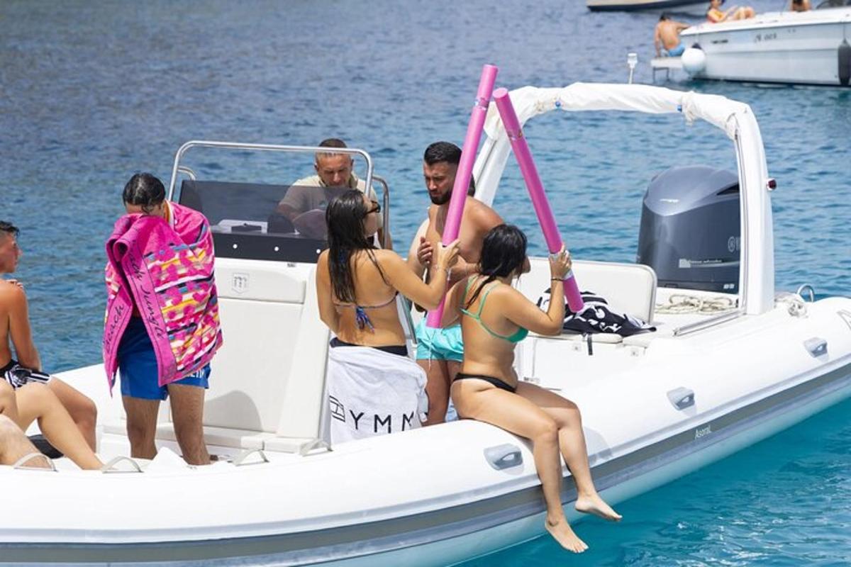 a group of people on a boat in the water