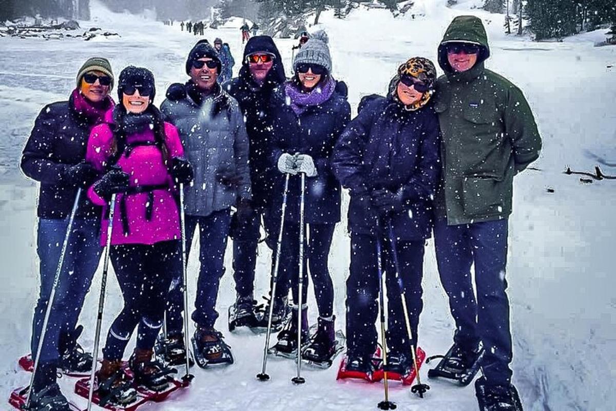 a group of people posing for a picture in the snow