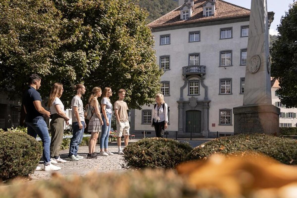 a group of children standing in front of a building