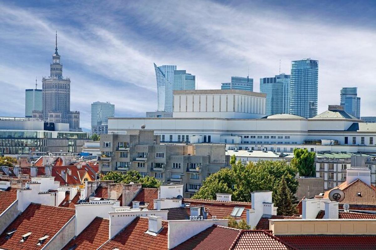 a view of a city with tall buildings and roofs