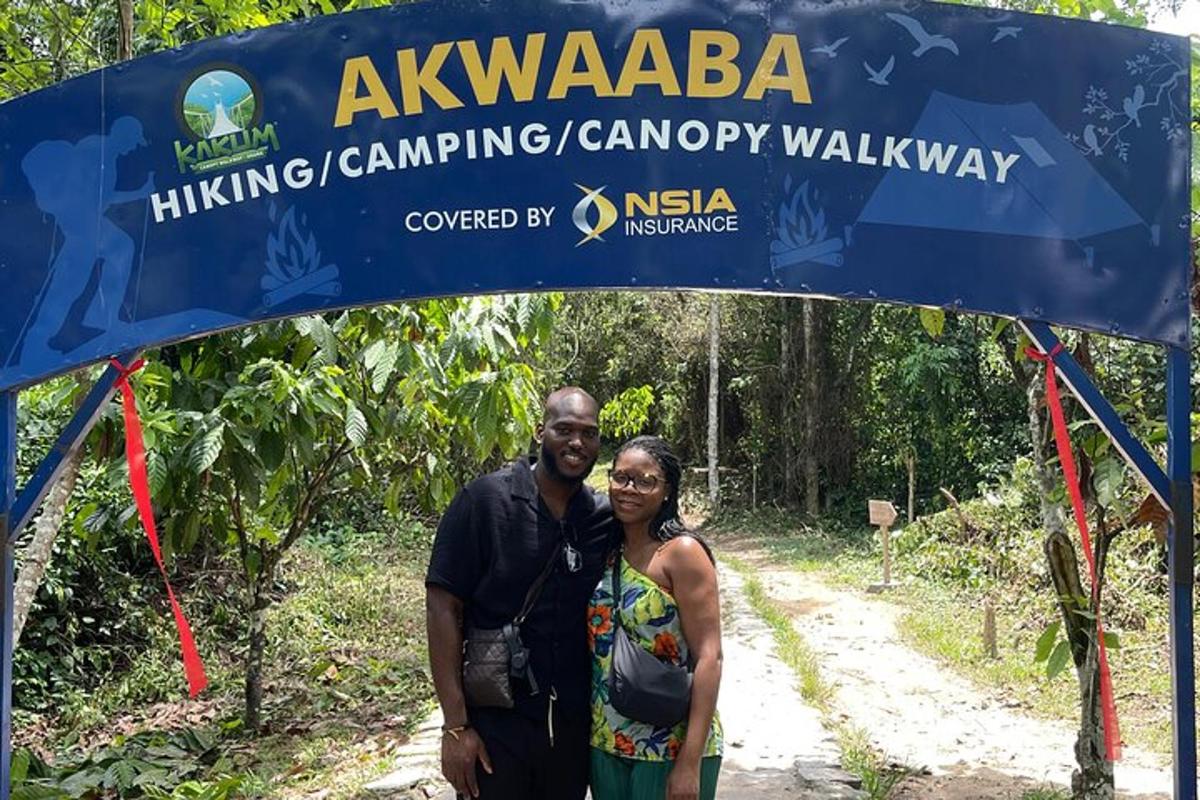 a man and a woman standing under a sign