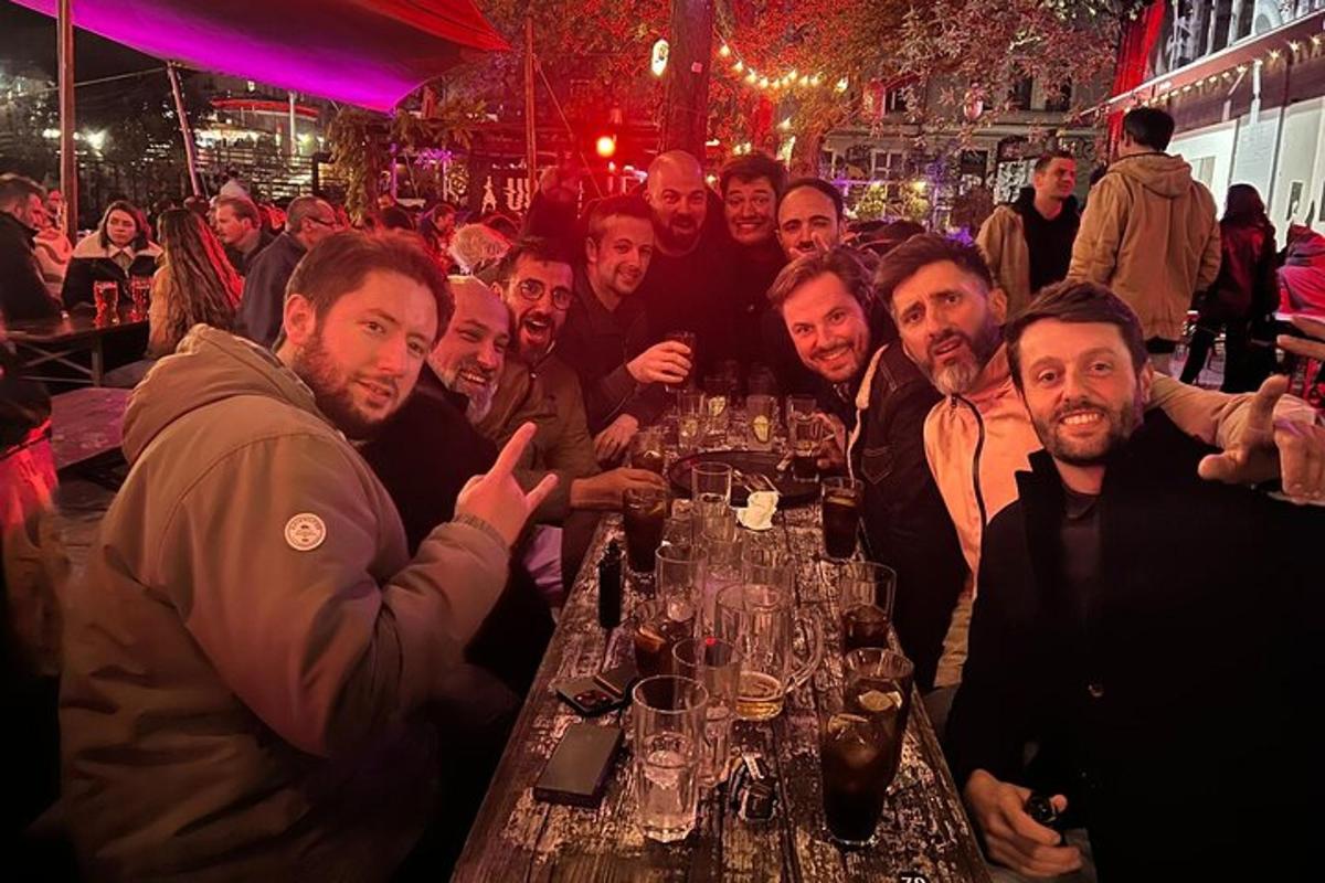 a group of men sitting at a table in a restaurant