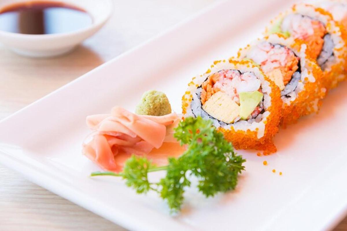 a white plate with sushi on a table