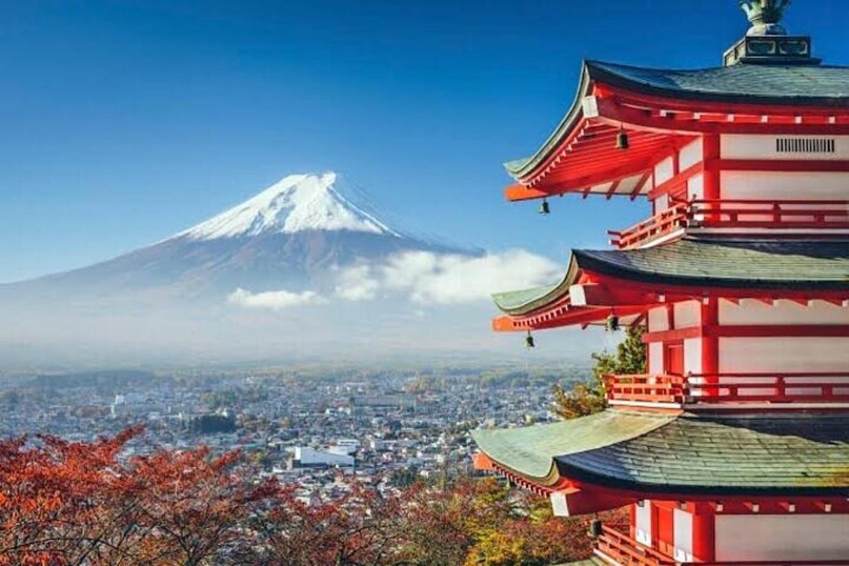 a pagoda with a mountain in the background