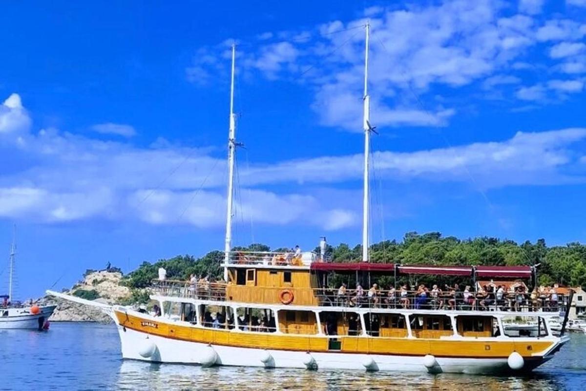 a yellow and white boat in the water