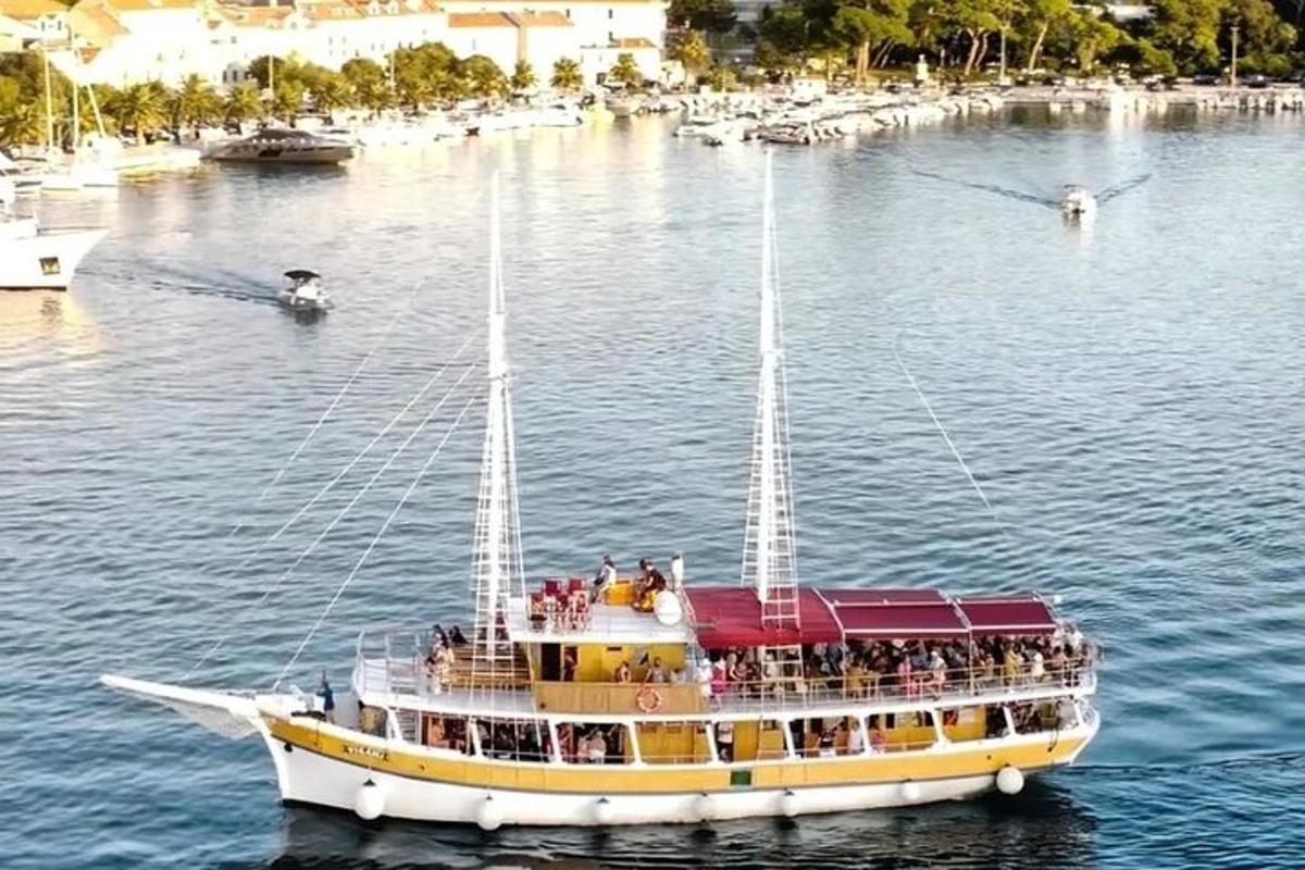 a boat with a group of people on it in the water