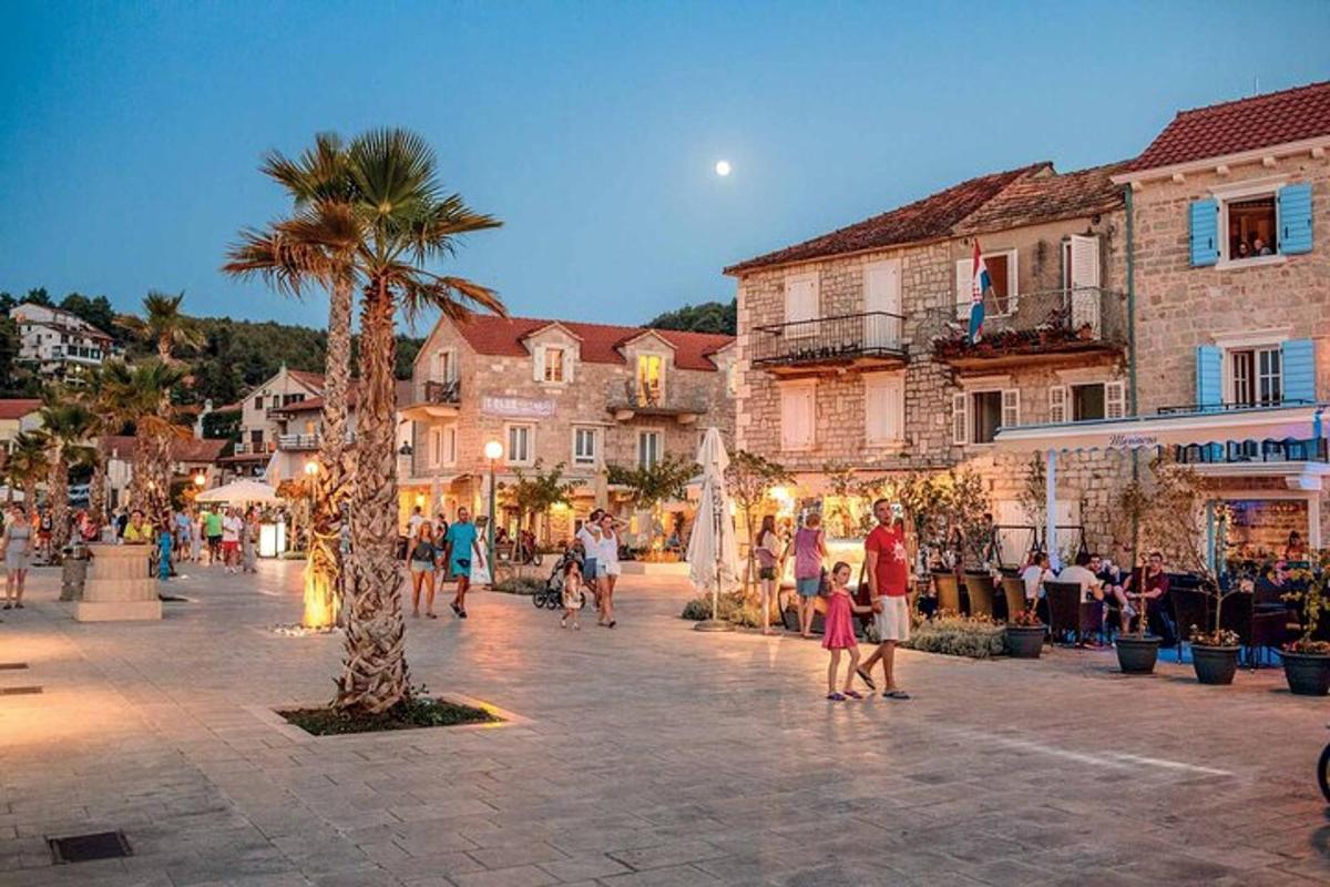 a group of people walking around a town square