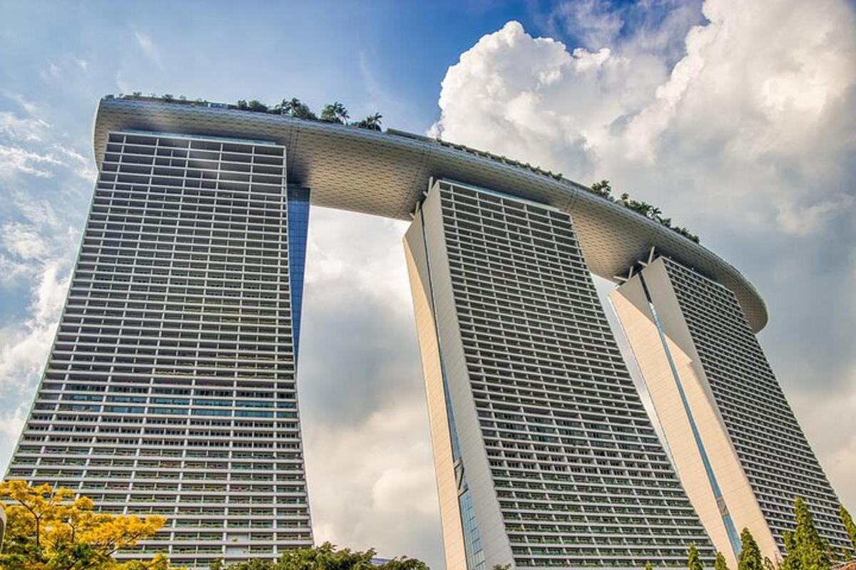 two tall buildings with trees on top of them