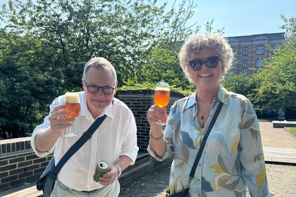a man and a woman holding glasses of wine