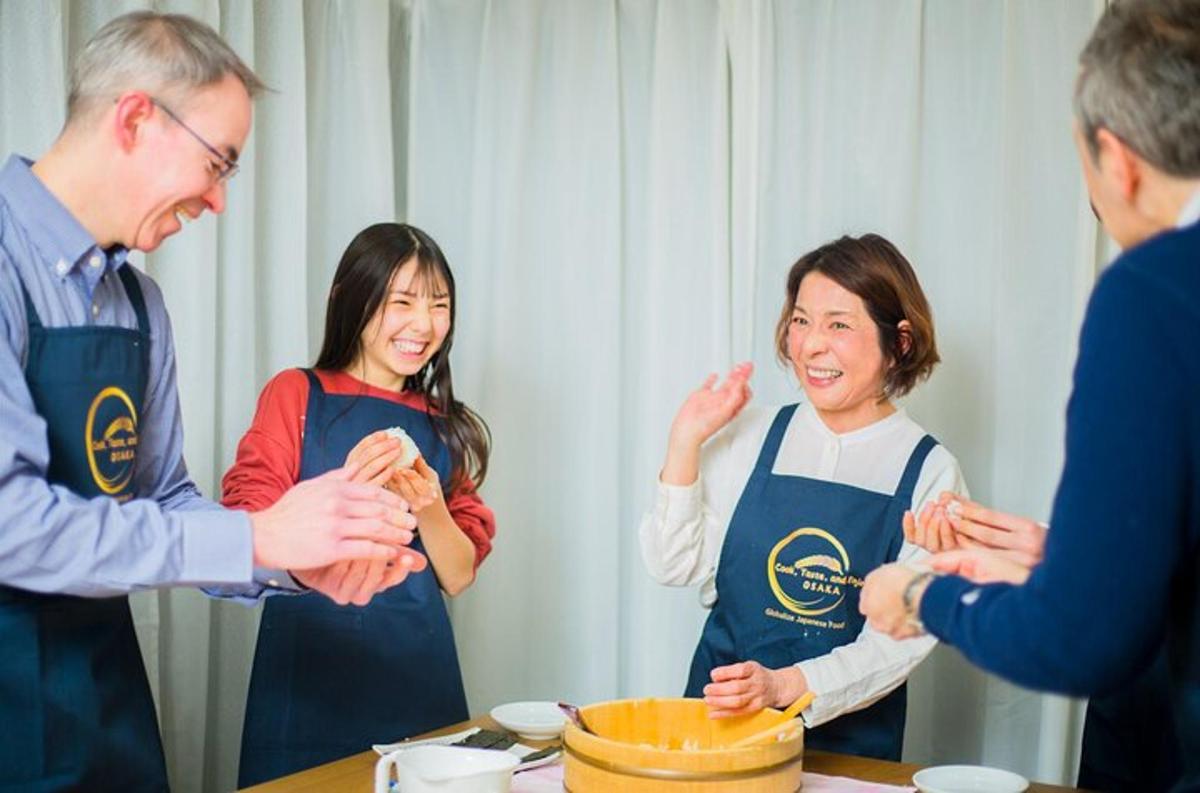 a group of people in a kitchen preparing food