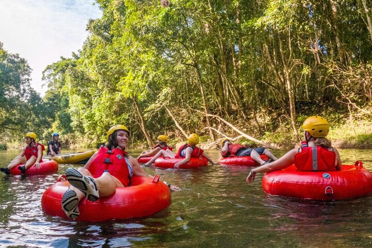 a group of people are rafting on a river