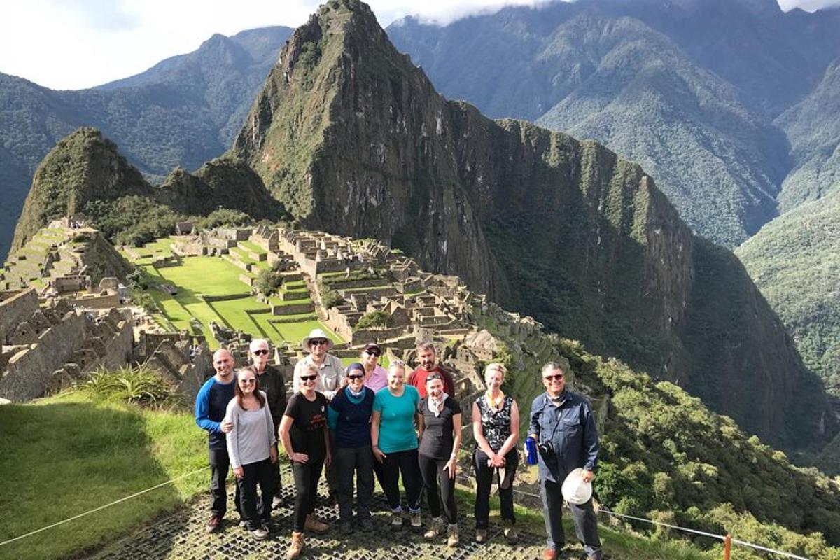 a group of people standing on top of a mountain