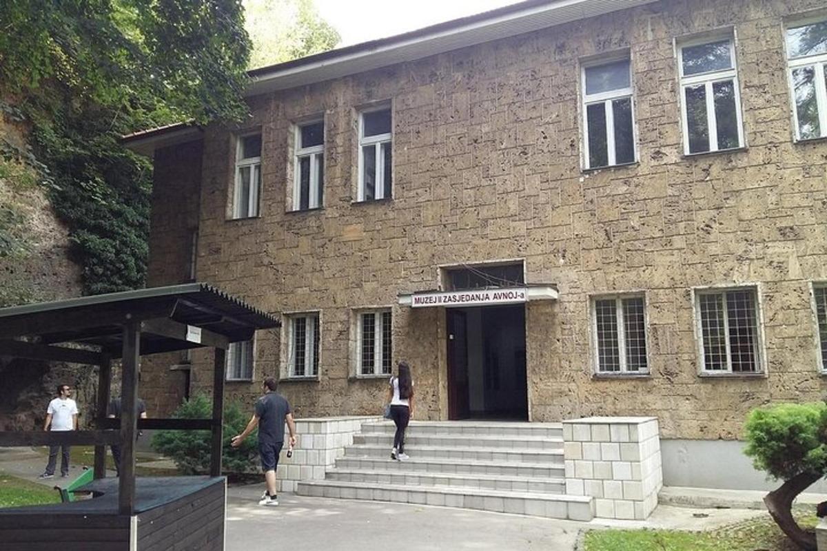 a building with people walking in front of it