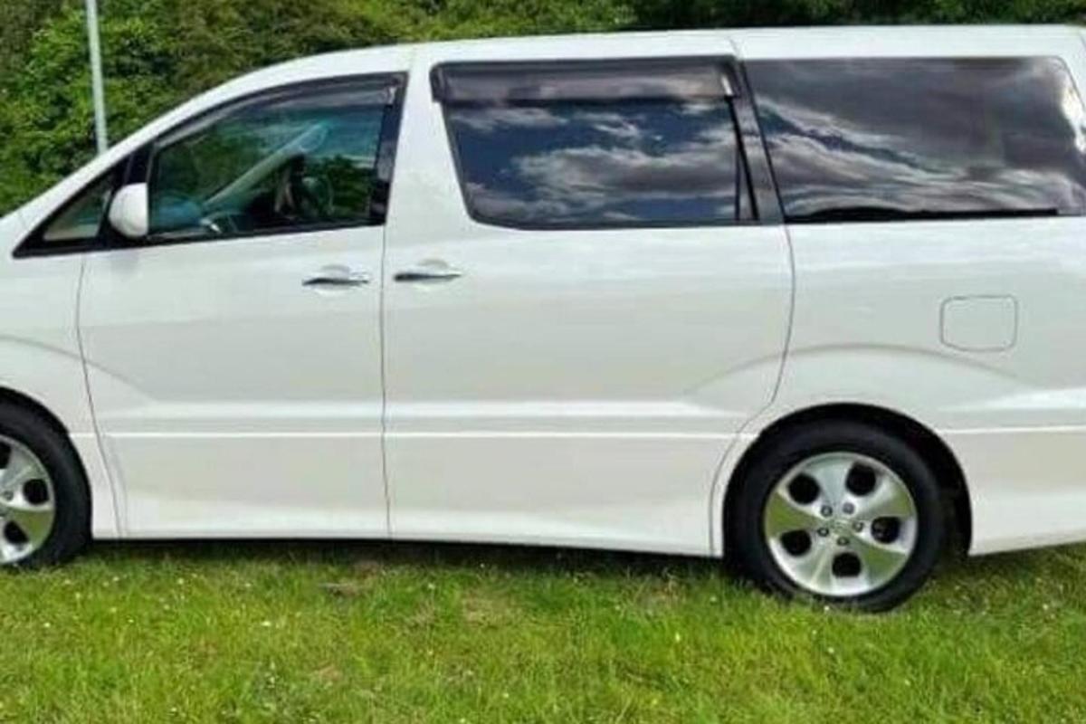a white van parked in the grass