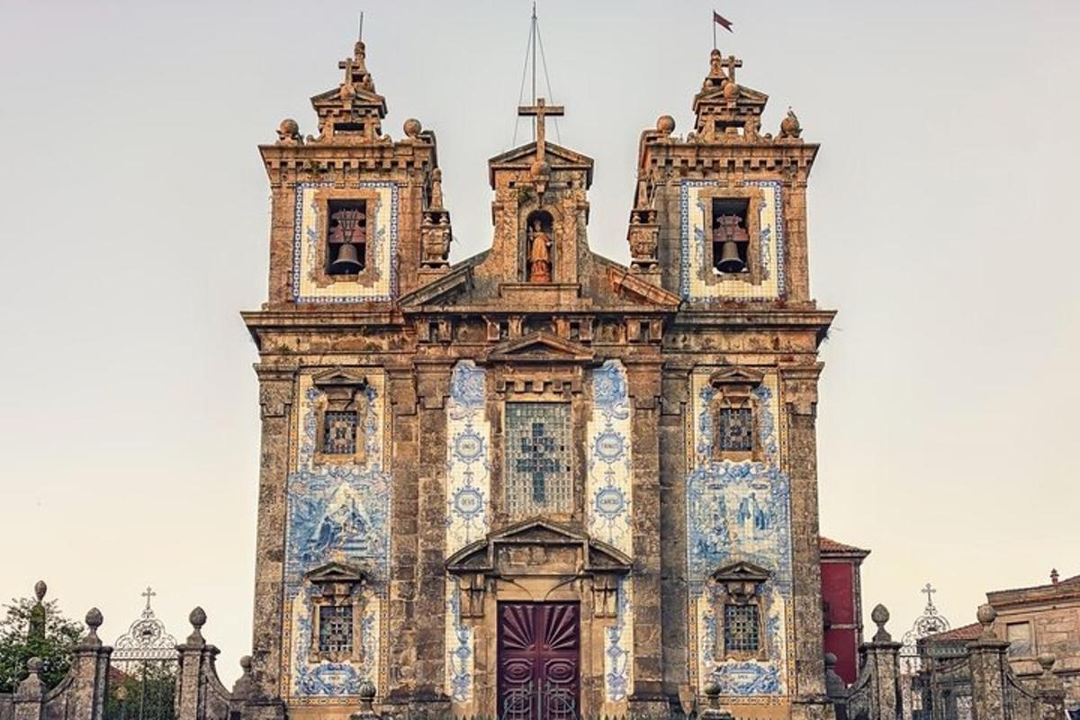 an old building with tiles on the front