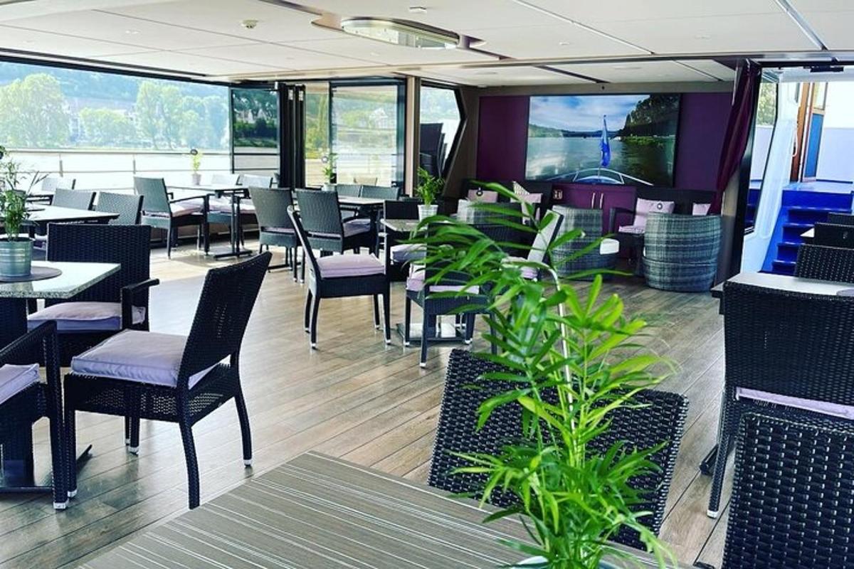 a restaurant with tables and chairs and windows