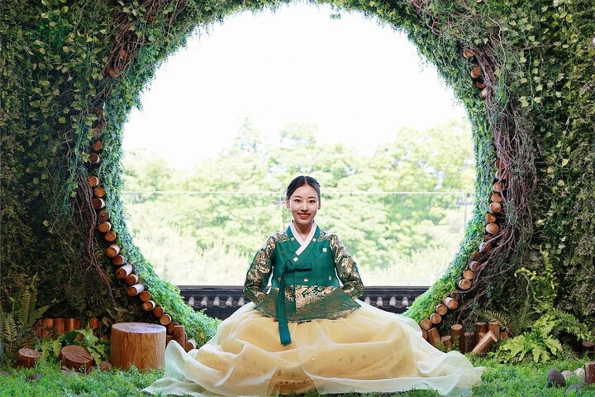 a woman in a dress sitting in an archway
