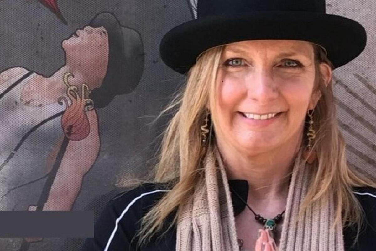 a woman wearing a hat and a scarf