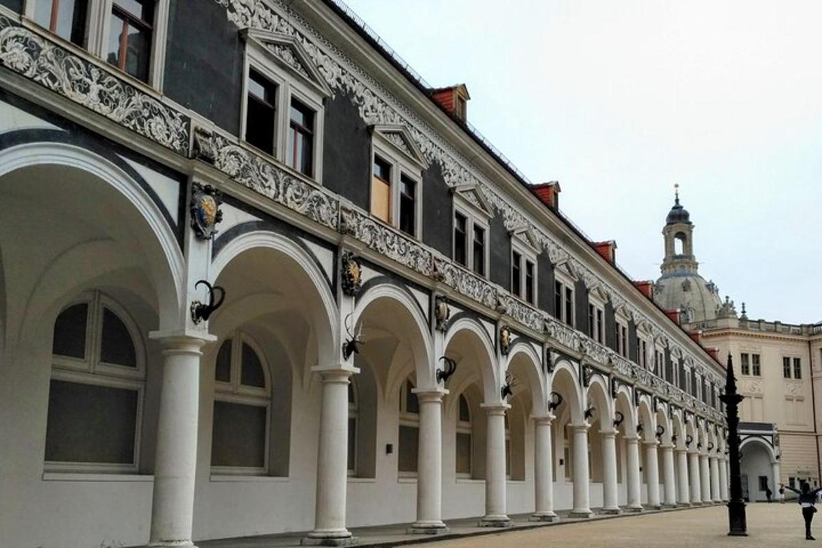 a large building with white columns and a clock tower