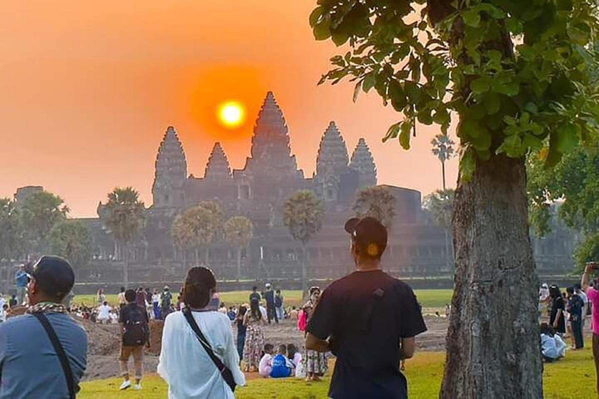 a group of people standing in front of a temple