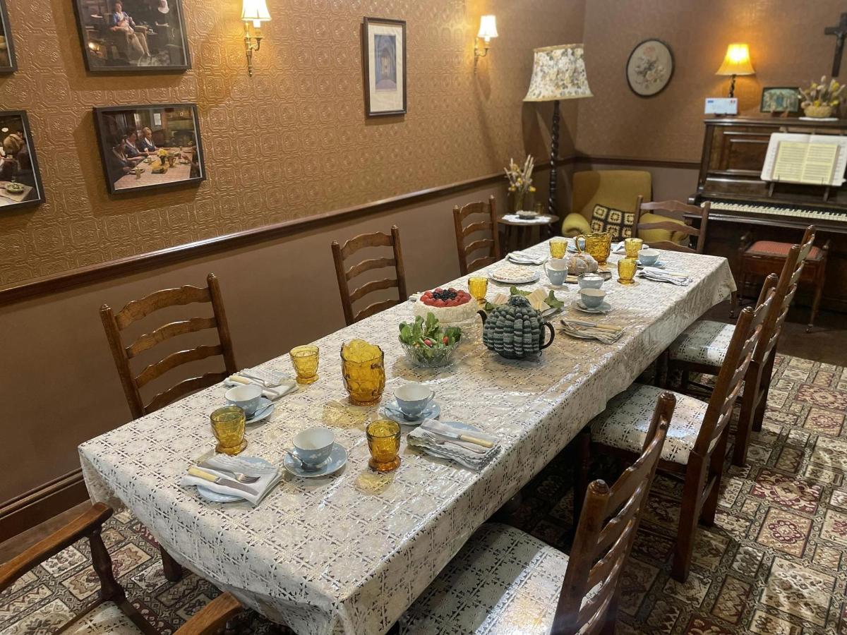 a table in a restaurant with a white table cloth