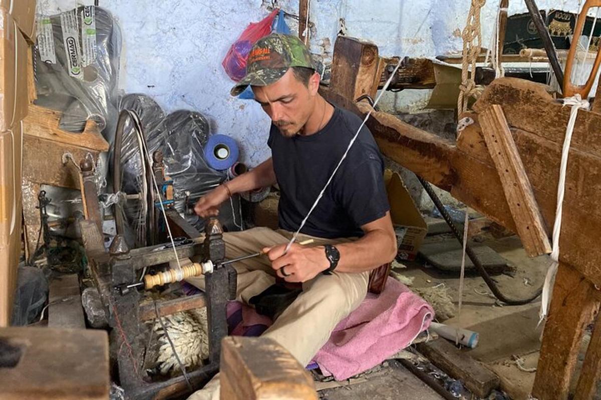 a man is working on a piece of wood