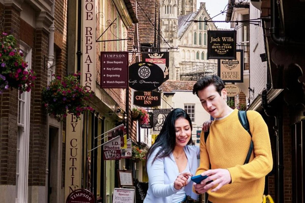 a man and a woman looking at a cell phone