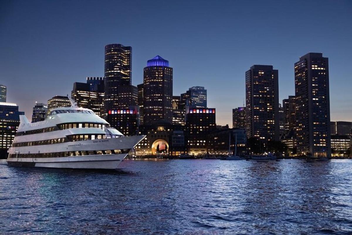 a cruise ship in the water in front of a city