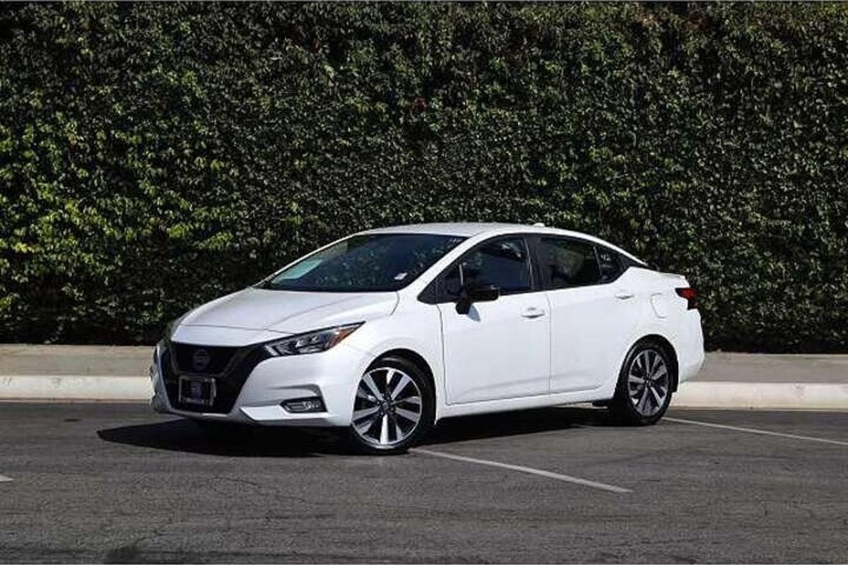 a white car parked in a parking lot