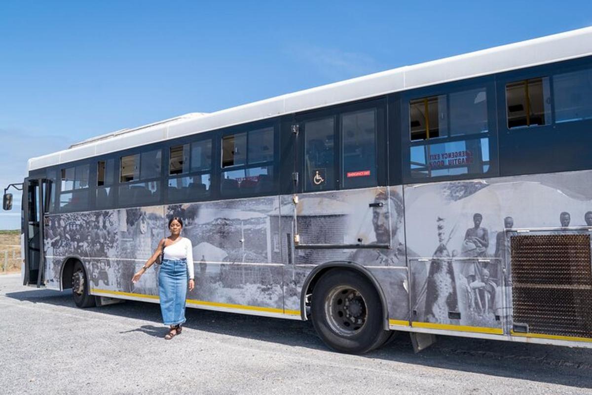 a woman is standing in front of a bus