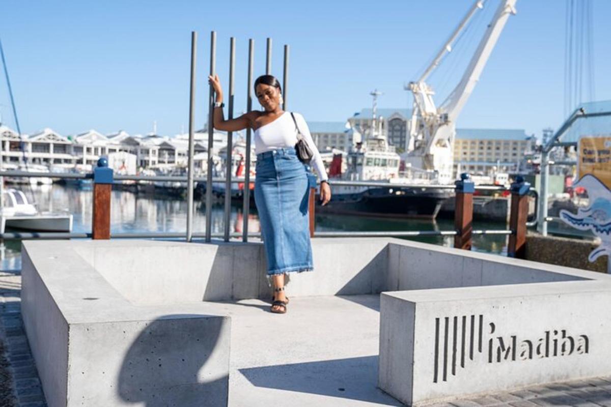 a woman standing on a dock near the water