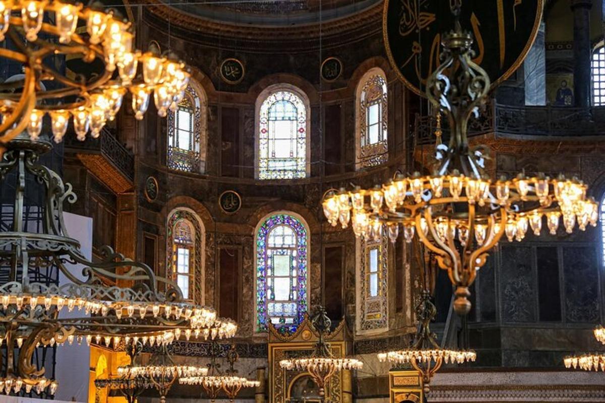 a large room with chandeliers and stained glass windows