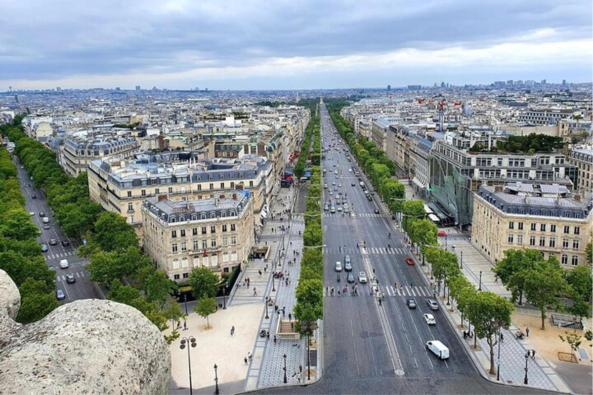 an aerial view of a city with a street and buildings