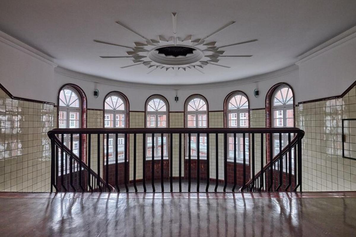 an empty room with a chandelier in a building