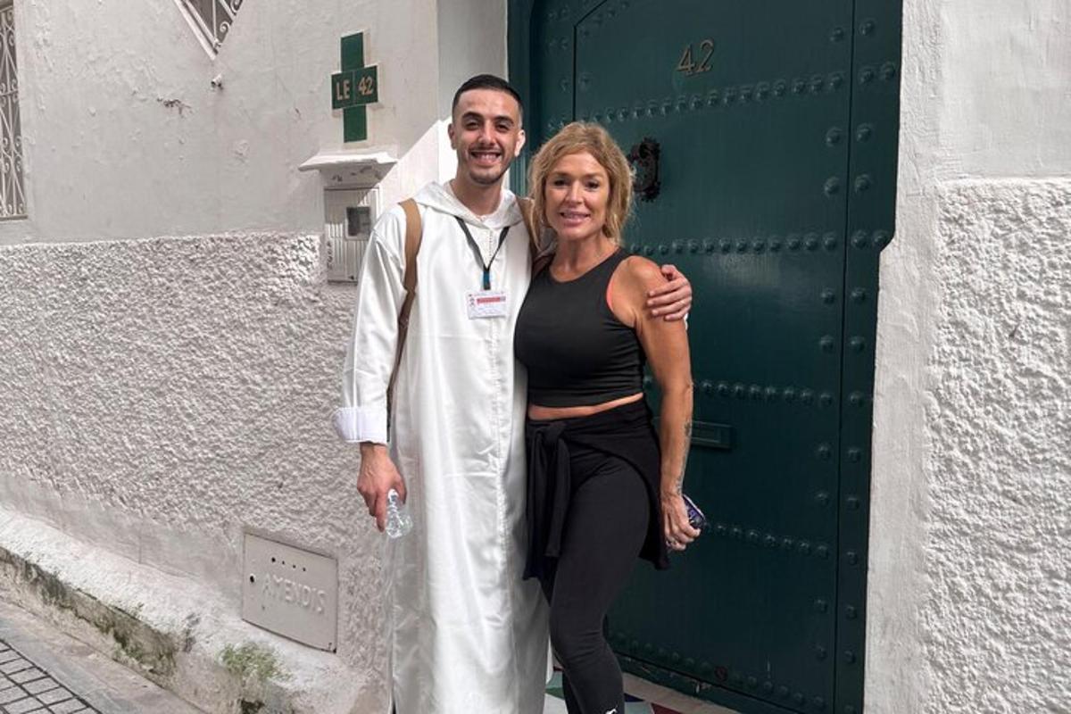 a man and a woman standing in front of a door