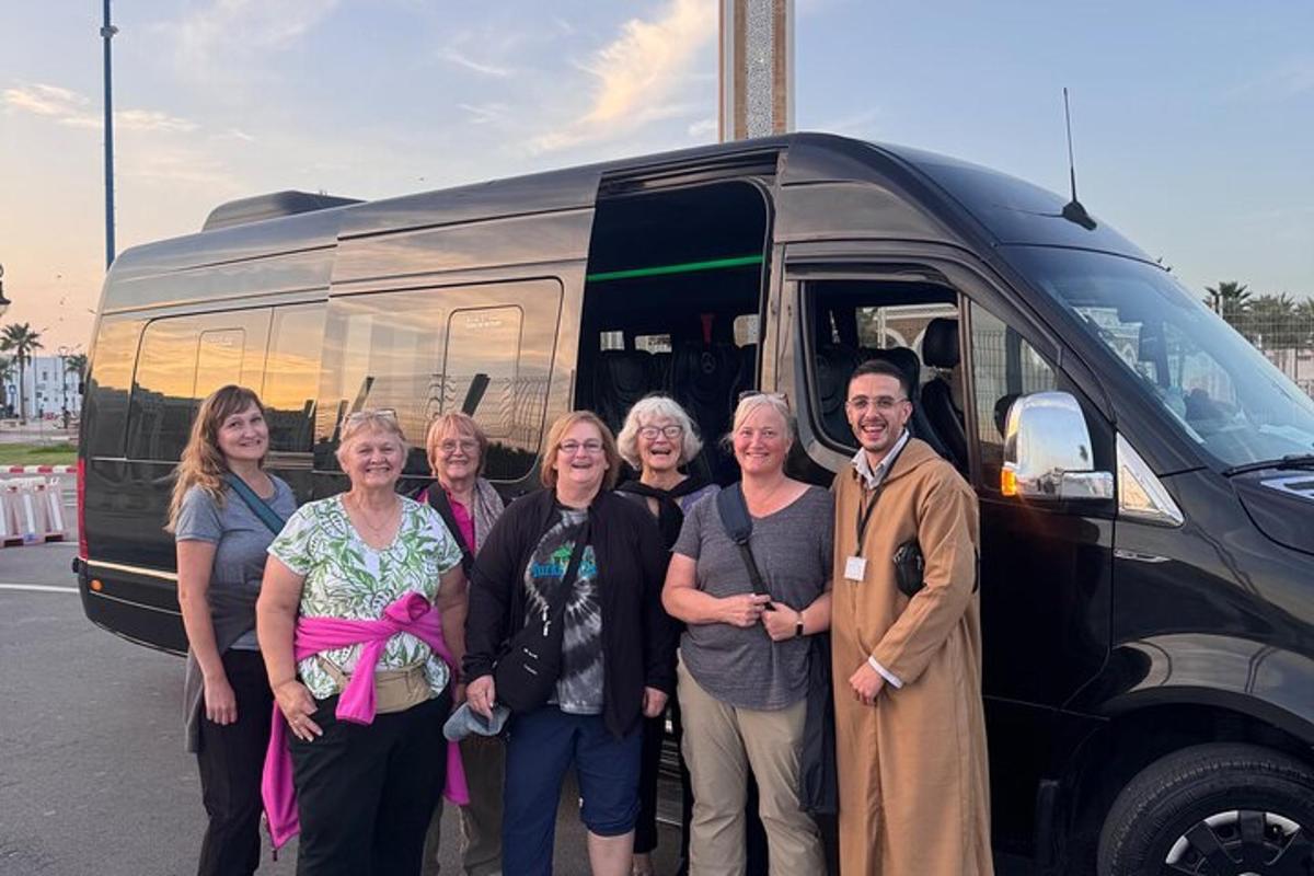 a group of people standing in front of a van