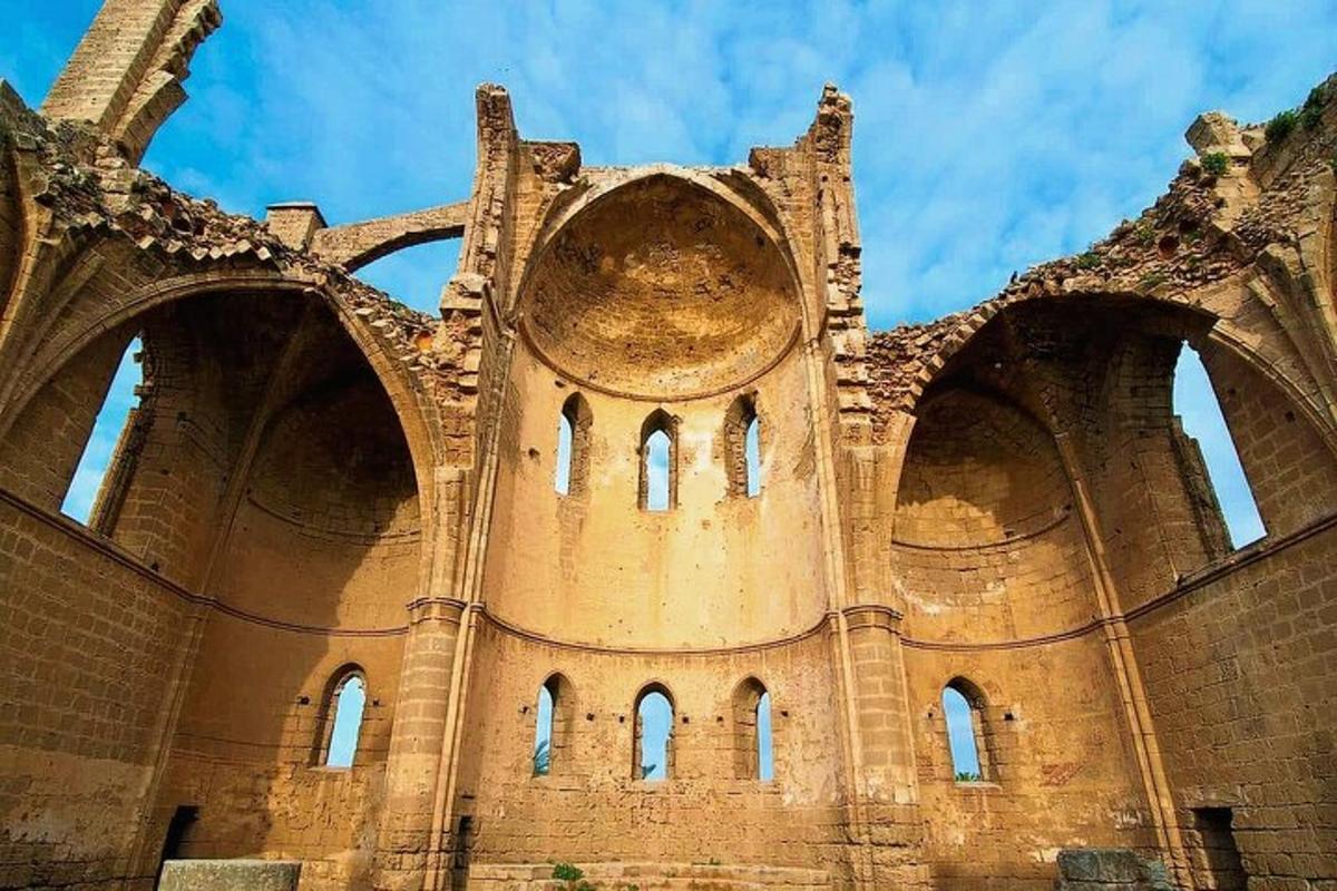 an old building with arches on the side of it