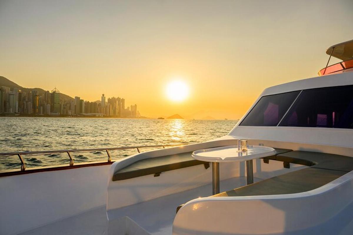 a table on the back of a boat with the sunset