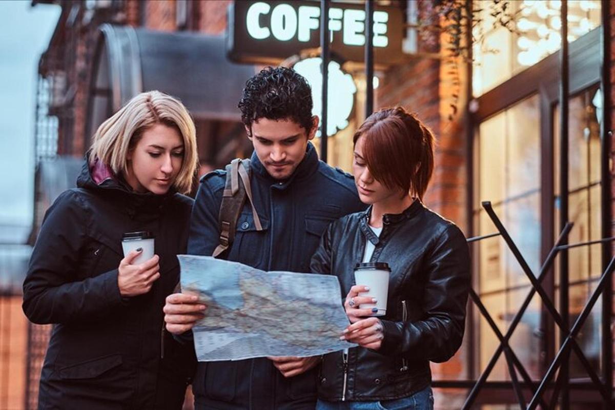 a group of three people looking at a map