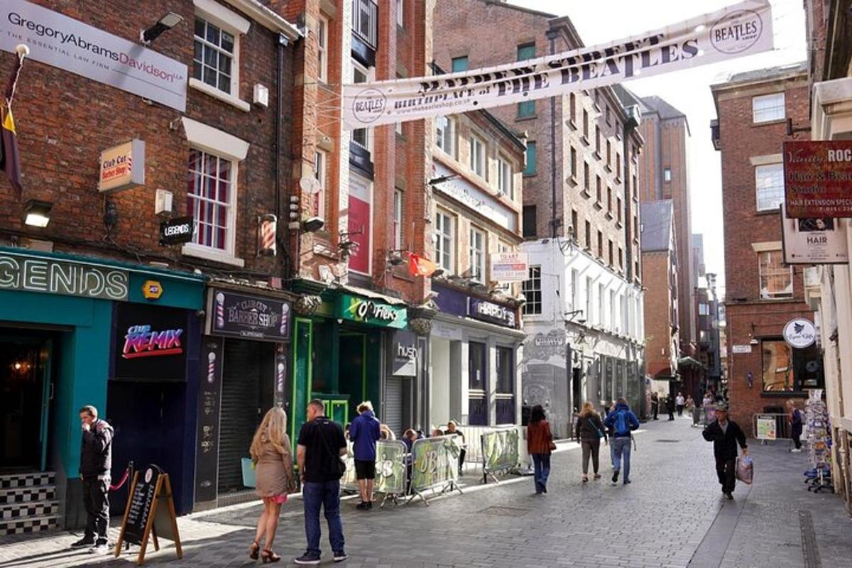 a group of people walking down a city street